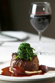 Fine Wines At Your Finger Tips.
A glass of wine and a plate of food.
